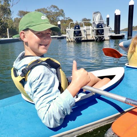 Person in kayak smiling at camera