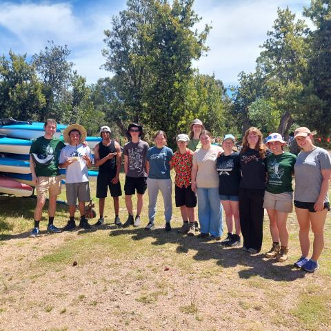 Group of campers standing in a group smiling at the camera