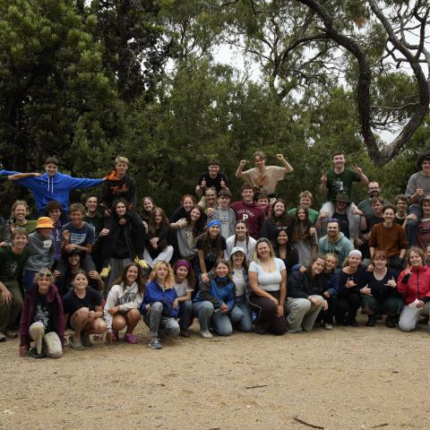 Group of campers standing in a group smiling at the camera